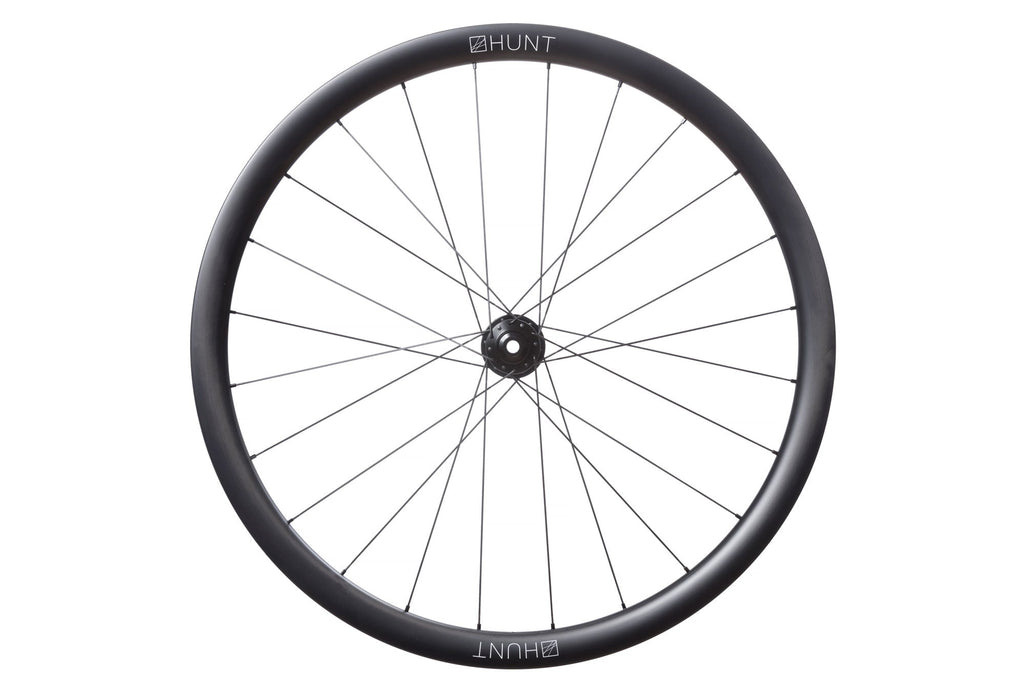 <h1>Rims</h1><i>A strong and super-lightweight hookless rim featuring unidirectional T24/30 carbon fibre with 3K weave re-enforced spoke holes. The wide aero profile delivers excellent handling and speed. The evolution of disc-specific construction has allowed massive weight savings over equivalent rim-brake rims. The removal of braking forces on the rim allows a strong but very light rim to be designed that can focus on it's primary roles of supporting the tyre and spoke forces.</i>